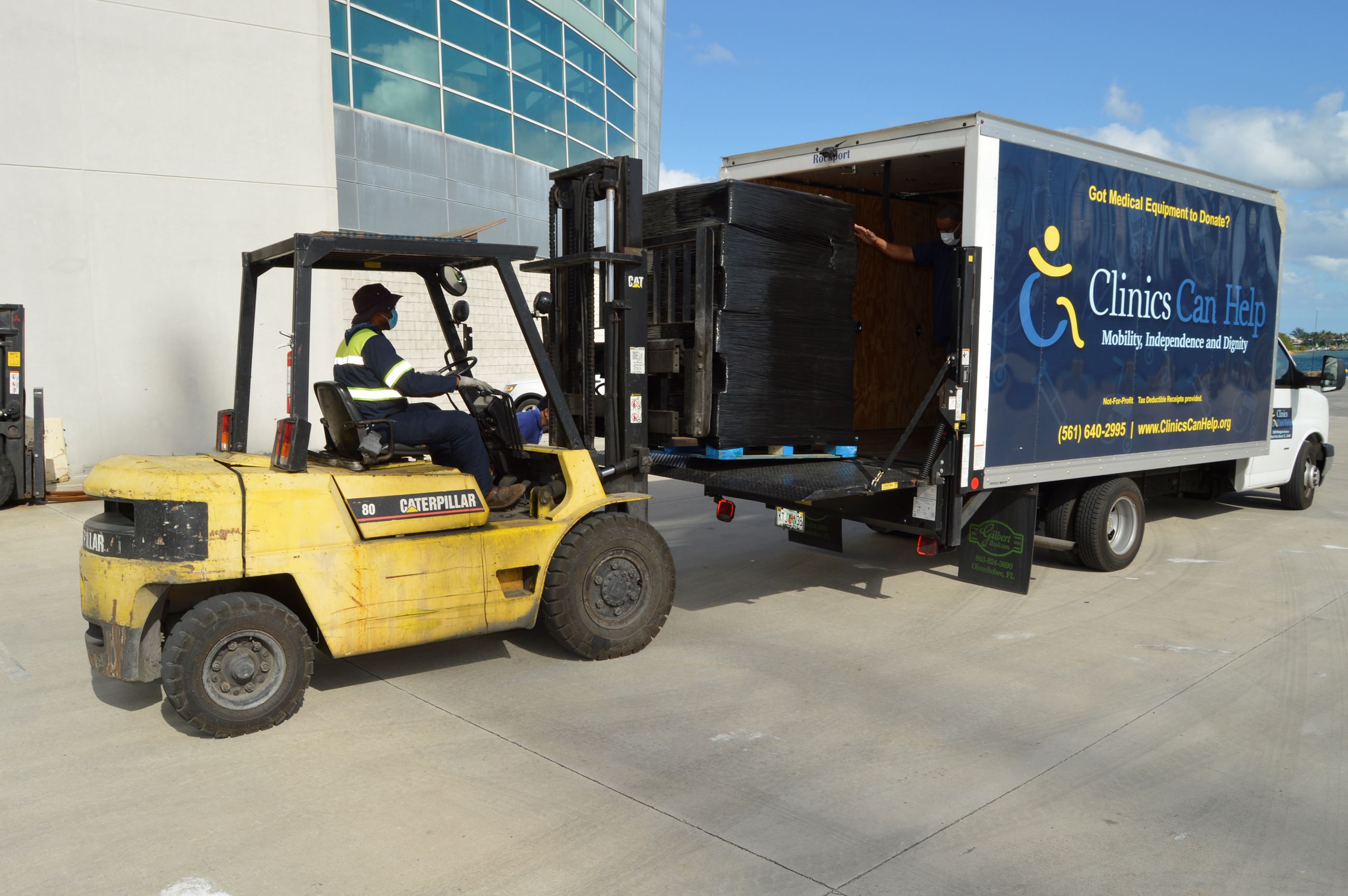 Port Facilities worker storing medical equipment 