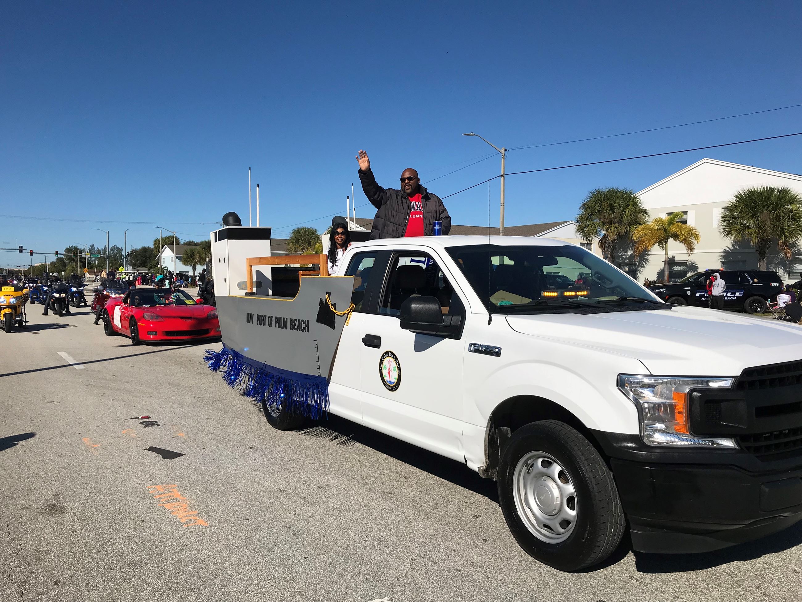 Port Commissioners Dr. Deandre Poole and Varisa Lall Dass on MLK parade float
