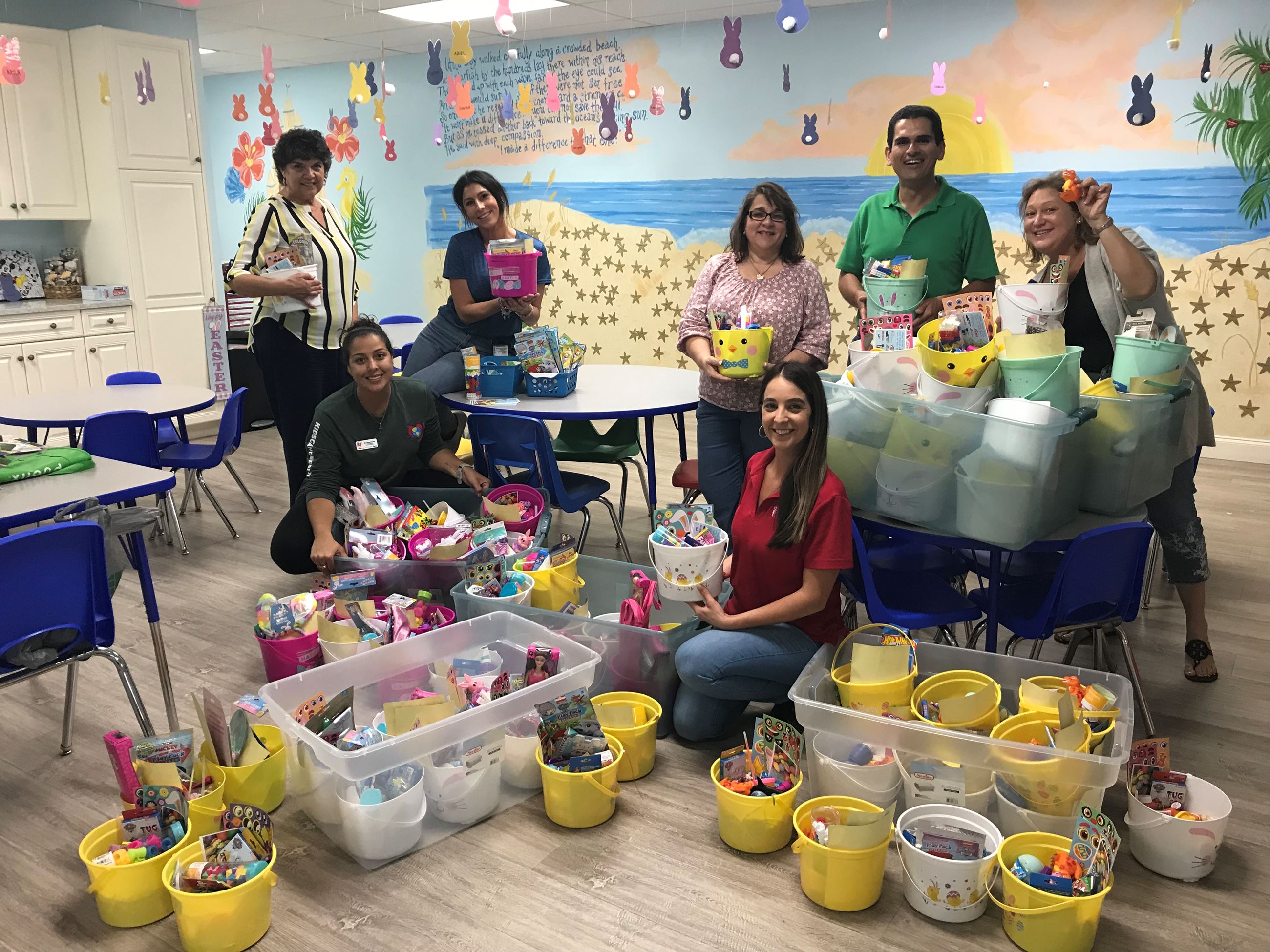 Port staff, tenants and Kids Cancer Foundation reps assembling baskets
